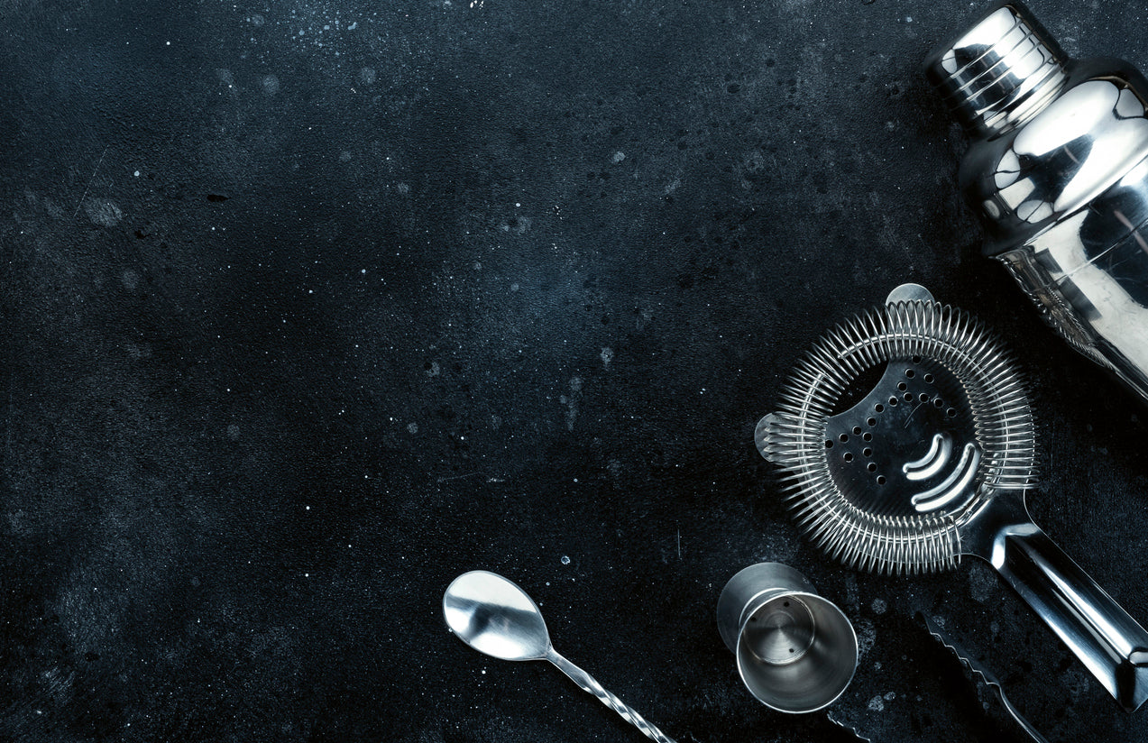Motta stainless steel bar tools on a dark counter